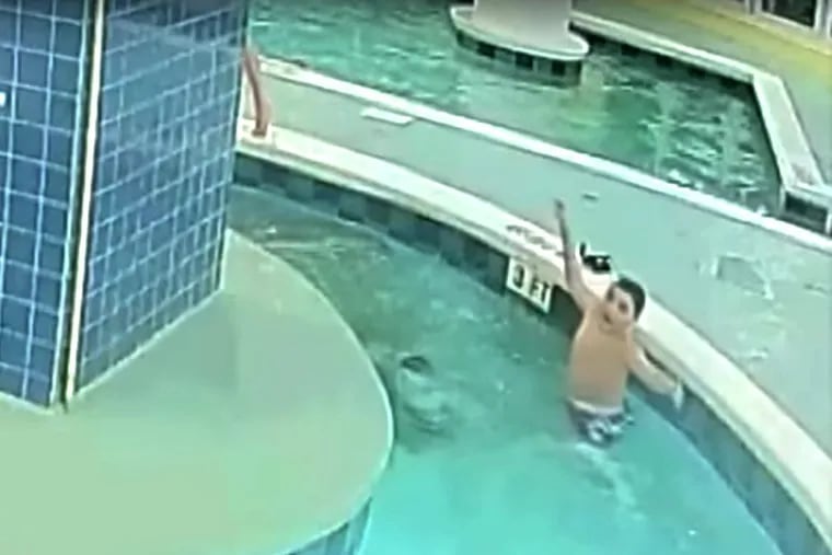 A young boy calls for help for a 12-year-old friend who became trapped underwater in a South Carolina resort pool.