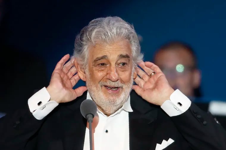 FILE - In this Aug. 28, 2019 file photo, opera star Placido Domingo listens to applause at the end of a concert in Szeged, Hungary, Wednesday, Aug. 28, 2019. When Domingo appeared in Europe last month after being accused of sexual harassment by multiple women, he was greeted with rapturous ovations. This week, the spotlight moves to the U.S., where the opera legend is due to help kick off the new season at New York’s Metropolitan Opera and where he faces two investigations into his behavior. The singer has called the allegations “in many ways, simply incorrect” without supplying any specifics.  (AP Photo/Laszlo Balogh, File)