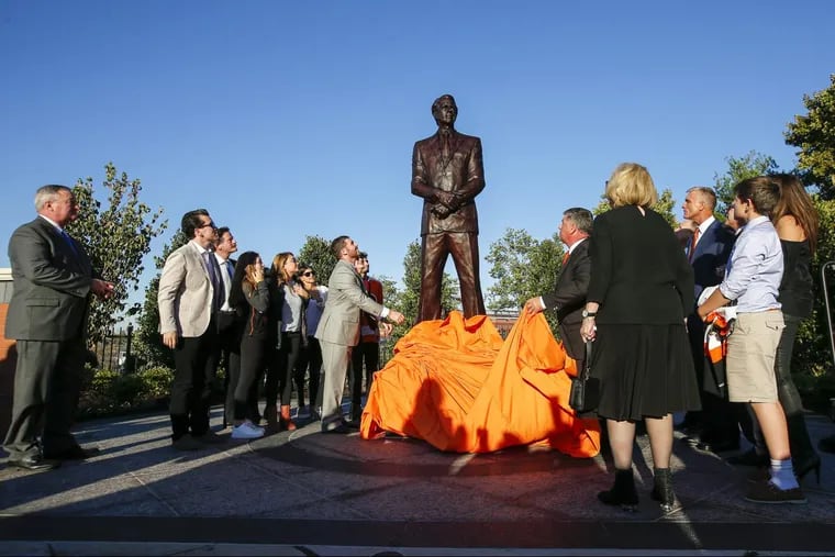 A statue of late Philadelphia Flyers owner Ed Snider stands outside the Wells Fargo Center in Philadelphia during an unveiling ceremony on Thursday.
