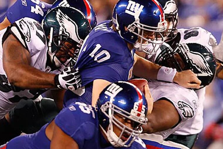 The Eagles kept Eli Manning mostly in check, and held the Giants' rushing attack to just 29 yards. (David Maialetti/Staff Photographer)