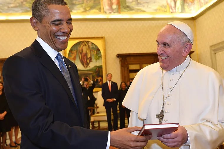 Pope Francis and President Obama smile as they exchange gifts, at the Vatican Thursday. President Obama called himself a "great admirer" of Pope Francis as he sat down at the Vatican Thursday with the pontiff, whom he considers a kindred spirit on issues of economic inequality. Their historic first meeting comes as Obama's administration and the church remain deeply split on issues of abortion and contraception.