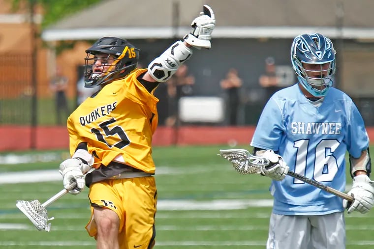 Moorestown attackman Nick Cataline (15) celebrates next to Shawnee midfielder Max Rebstock after scoring a goal in the third quarter of the South Jersey Group 3 lacrosse championship game.