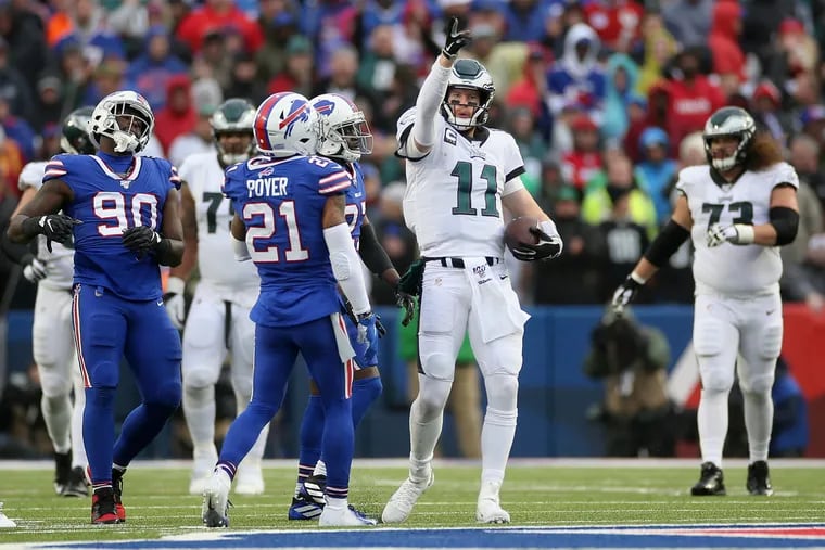 Eagles quarterback Carson Wentz (11) gestures after rushing for a first down in the fourth quarter of a game against the Buffalo Bills at New Era Field in Orchard Park, N.Y., on Sunday, Oct. 27, 2019.
