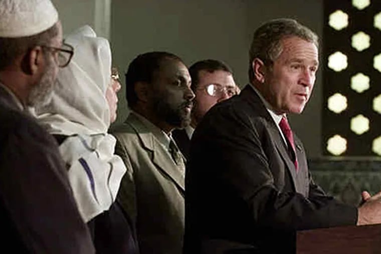 During a visit to the Islamic Center of Washington in September 2001, President George W. Bush spoke of Muslims' contributions. (Doug Mill/Associated Press)