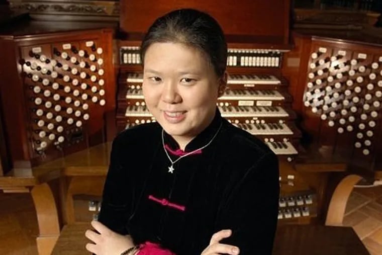 Stephanie Yen-Mun Liem Azar, 26, of Haverford, a talented musician who was training as a physician, died last Friday, five days after her 26th birthday. Behind her in the photo is the famed Curtis Organ at the Curtis Institute of Music. (Credit: The Liem family)