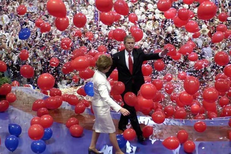 George W. and Laura Bush walk through a sea of balloons at the 2000 RNC in Philly.