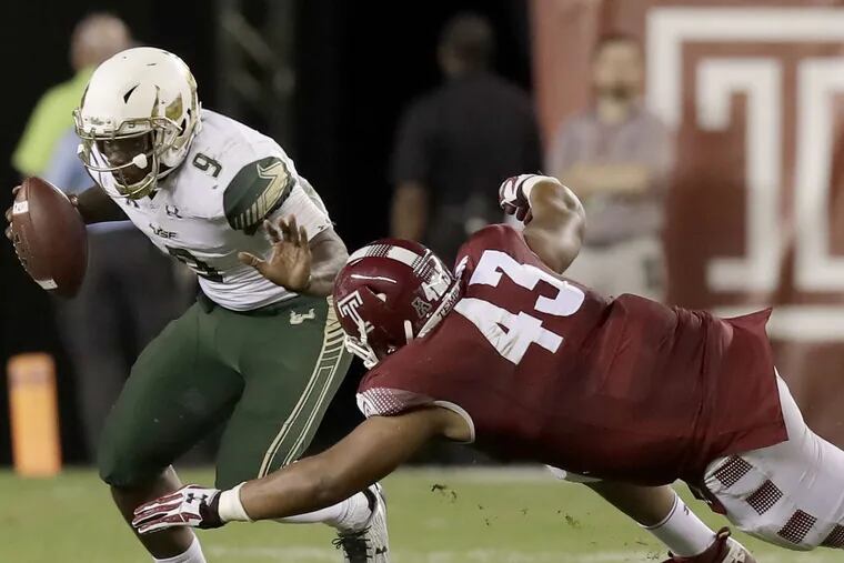 Temple defensive lineman Averee Robinson goes after USF’s Quinton Flowers.