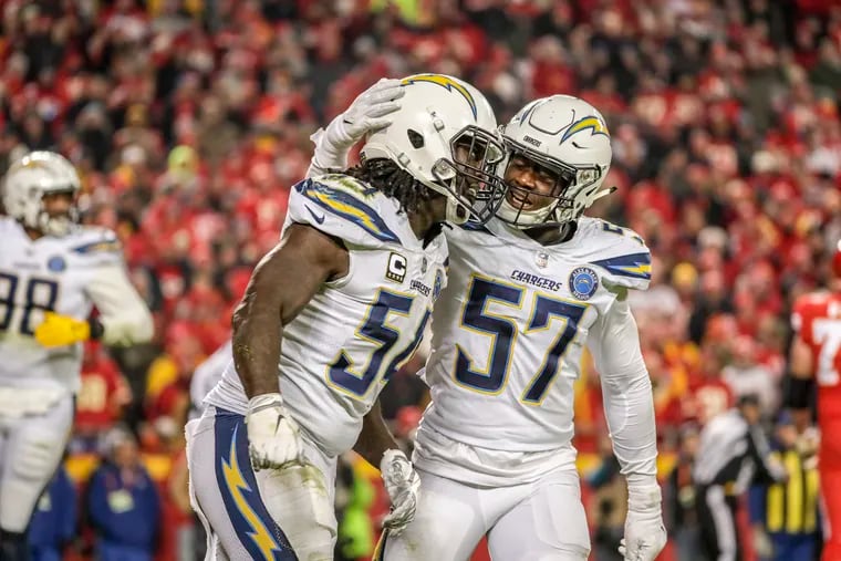 Jatavis Brown (57) congratulates former Chargers teammate Melvin Ingram after Ingram sacked Kansas City quarterback Patrick Mahomes during a game back in Dec. 2018. Now an Eagle after signing a one-year contract, Brown hopes to bring speed to the team's linebacking corps.