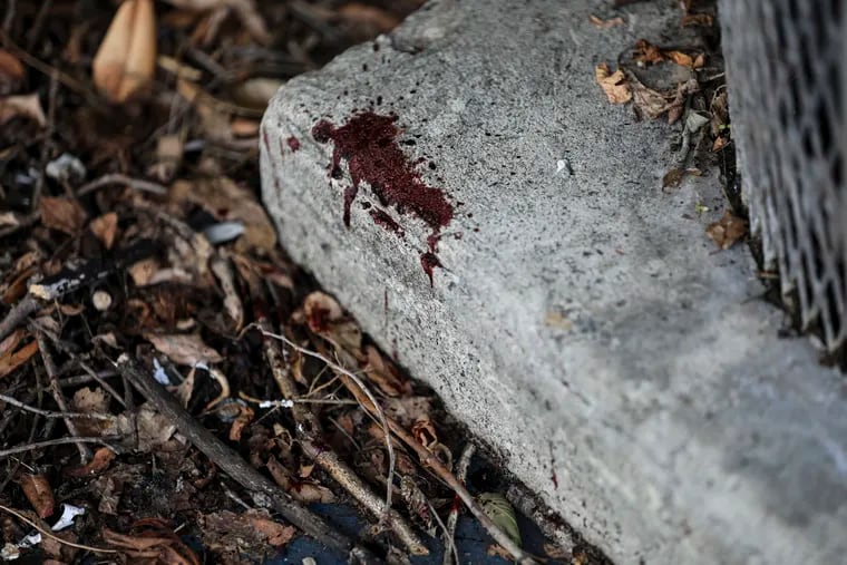 Blood dries on the concrete at the Clayborn Lewis Community Center Playground at 38th and Poplar Streets the morning after six people were shot in Philadelphia on Sunday, August 9, 2020.
