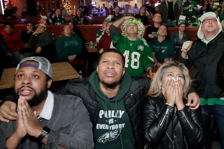 Eagles fans at Xfinity Live! watch a nailbiter as the Eagles defeat the Rams in a game last December.
