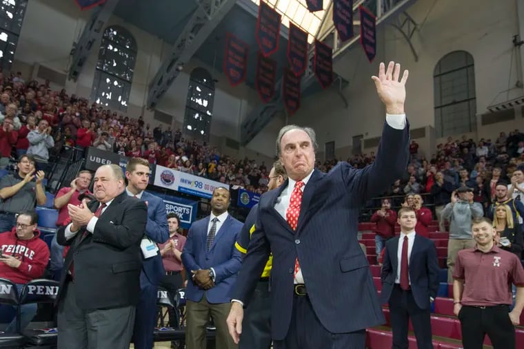 Temple coach Fran Dunphy acknowledges a standing ovation before the Owls' game against Drexel on Dec. 22, 2018.  At the time, it was believed to be Dunphy's last game coaching at the Palestra.