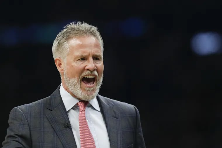 Sixers coach Brett Brown yells against the Boston Celtics on Tuesday, October 16, 2018 in Boston.