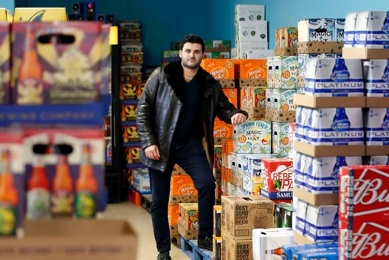 GoPuff cofounder Rafael Ilishayev in 2018, displaying one of the company's big sellers, beer