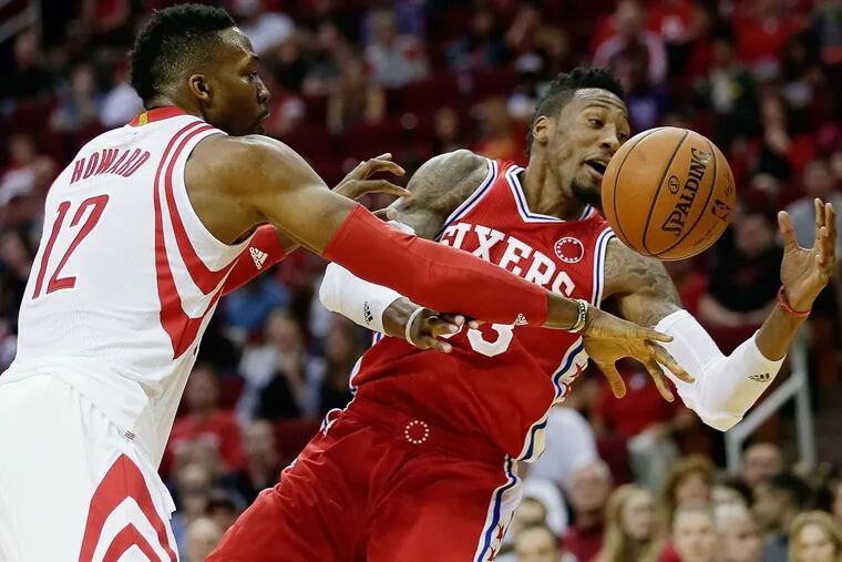 Sixers forward Robert Covington (33) is fouled by Houston Rockets center Dwight Howard (12) in the first half.