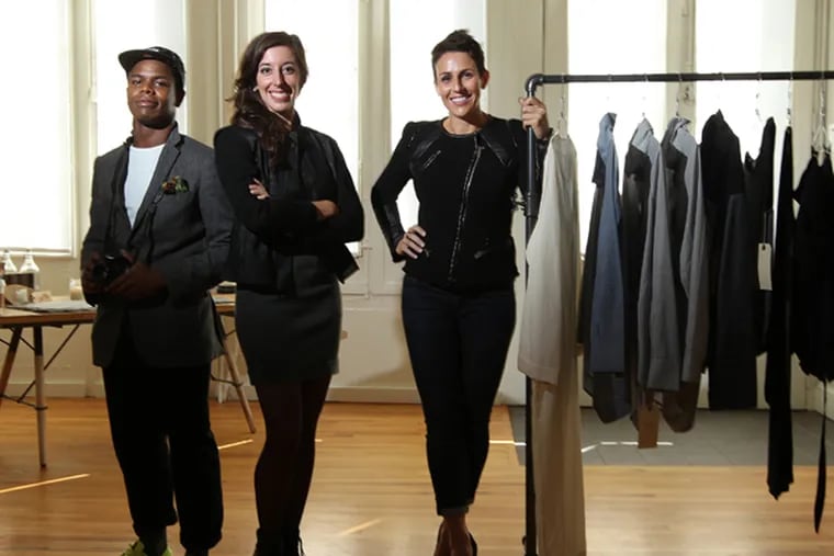 HyLo's creative director Lendel Tellington, left, President and founder Jennifer Green, center and Tina DeVita, Retail Clothing partner, right, make up the HyLo Boutique in Center City. (MICHAEL BRYANT / Staff Photographer)