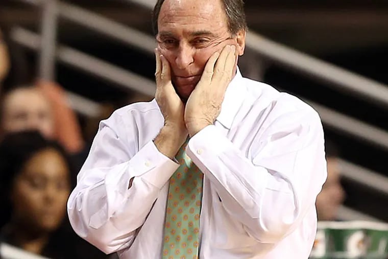 Temple head coach Fran Dunphy puts his hands on his face during the
second half. (Yong Kim/Staff Photographer)