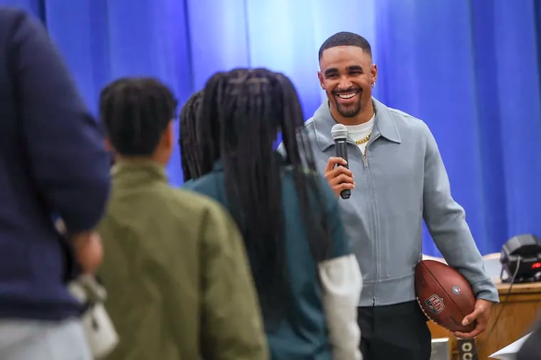 Eagles quarterback Jalen Hurts takes questions from students in the auditorium of Edward Gideon Elementary School in Philadelphia on Friday, April 19, 2024.   Hurts donated $200,000 to the Philadelphia School District to install new air conditioners in 10 schools. .