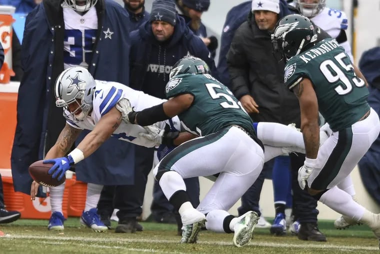 Cowboys quarterback Dak Prescott dives trying for a first down as Eagles linebacker Najee Goode tackles him as Mychal Kendricks trails during the Eagles’ 6-0 loss to the Cowboys on Sunday.