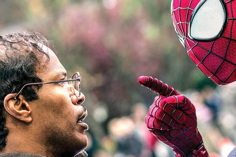 This image released by Sony Pictures shows Jamie Foxx, left, and Andrew Garfield as Spider-Man in "The Amazing Spider-Man 2." (AP Photo/Columbia Pictures - Sony Pictures, Niko Tavernise)