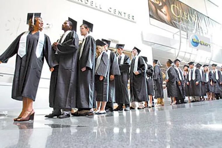 Science Leadership Academy seniors await their graduation procession. Ninety-seven percent will attend college; 40 percent plan majors in science, technology, or math. (DAVID SWANSON / Staff Photographer)