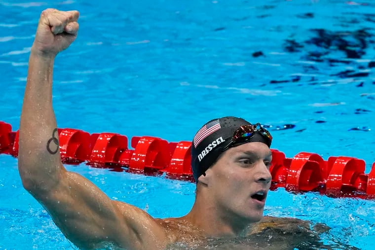 Caeleb Dressel celebrates winning the gold medal the men's 50-meter freestyle.