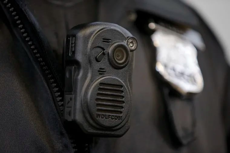 A Philadelphia Police officer demonstrates a body-worn camera in 2014. (AP Photo/Matt Rourke)