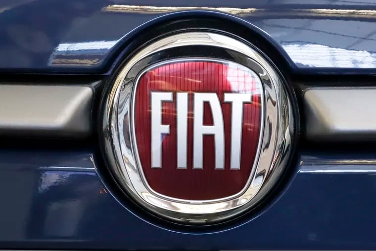 FILE - In this Feb. 14, 2019, file photo, this is the Fiat logo is mounted on a 2019 500 L on display at the 2019 Pittsburgh International Auto Show in Pittsburgh. Fiat Chrysler is proposing a merger with French carmaker Renault aimed at saving billions of dollars for both companies. (AP Photo/Gene J. Puskar, File)