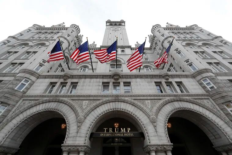 FILE - In this Dec. 21, 2016, file photo, the Trump International Hotel at 1100 Pennsylvania Avenue NW, is seen in Washington. Justice Department’s lawyers appeared to be challenging a Maryland federal judge’s decision to allow a case against President Donald Trump to move forward. The Nov. 30, 2018, filing, however, was merely a notice to the court. It comes as U.S. District Court Judge Peter J. Messitte is poised to allow the subpoenas to begin flowing on Monday. Such information would likely provide the first clear picture of Trump’s Washington, D.C. hotel’s finances. (AP Photo/Alex Brandon, File)