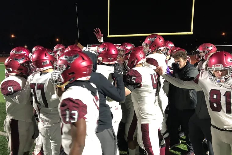 St. Joe's Prep's players celebrates after defeating Northeast, 49-14, for the PIAA District 12 Class 6A championship.