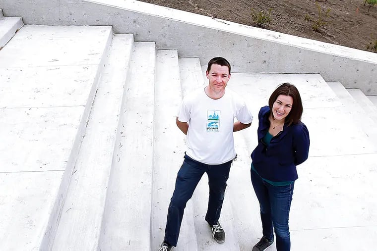 Josh Nims and Claire Laver stand inside the soon-to-be-completed Paine's Park, a new skate park, in Philadelphia on May 7, 2013. (DAVID MAIALETTI/Staff Photographer)