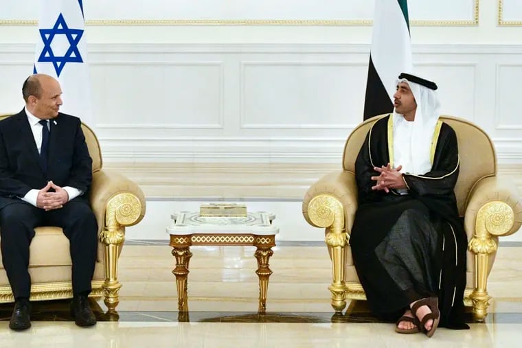 In this photo provided by the Israel Government Press Office (GPO), Israeli Prime Minister Naftali Bennett, left, meets with UAE Foreign Minister, Sheikh Abdullah bin Zayed Al Nahyan, in Abu Dhabi, Sunday, Dec. 12, 2021.