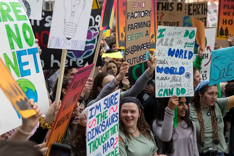 Students from around the Philadelphia region along with people of all ages come together in front of City Hall to take part in a global climate strike on Friday afternoon, March 15, 2019. An initial rally was planned starting at noon to 2 p.m. at Love Park, followed by the main rally at City Hall.