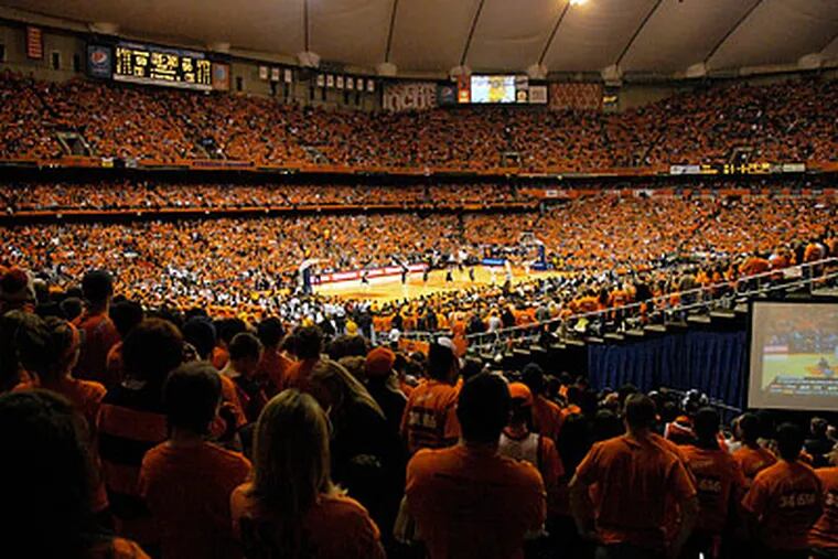 Syracuse set an NCAA attendance record on Saturday as 34,616 fans packed the Carrier Dome. (Kevin Rivoli/AP)