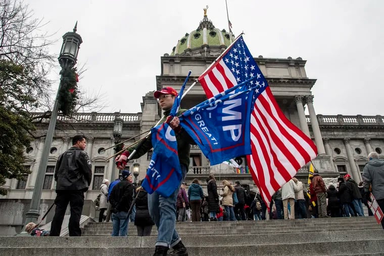 Trump supporters protest for Congress to de-certify election results during a rally on the steps of the Pennsylvania's State Capitol Building Harrisburg.