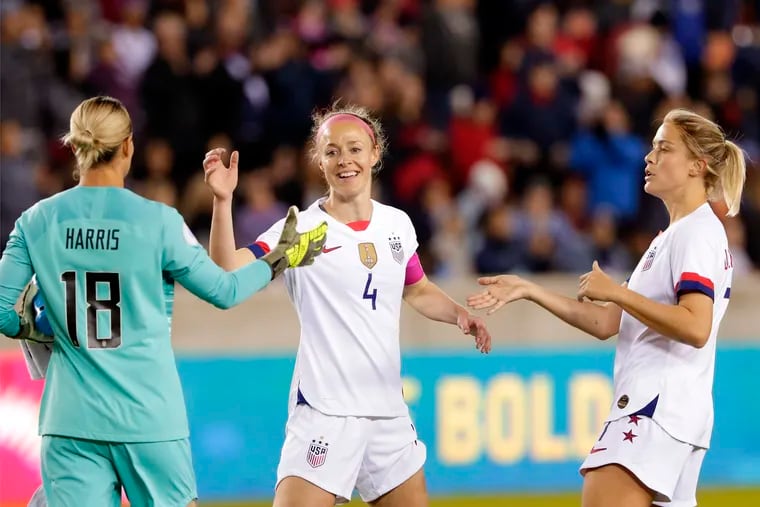 U.S. goalkeeper Ashlyn Harris (18), defender Becky Sauerbrunn (4) and defender Abby Dahlkemper, right, celebrate the team's 8-0 win over Panama.