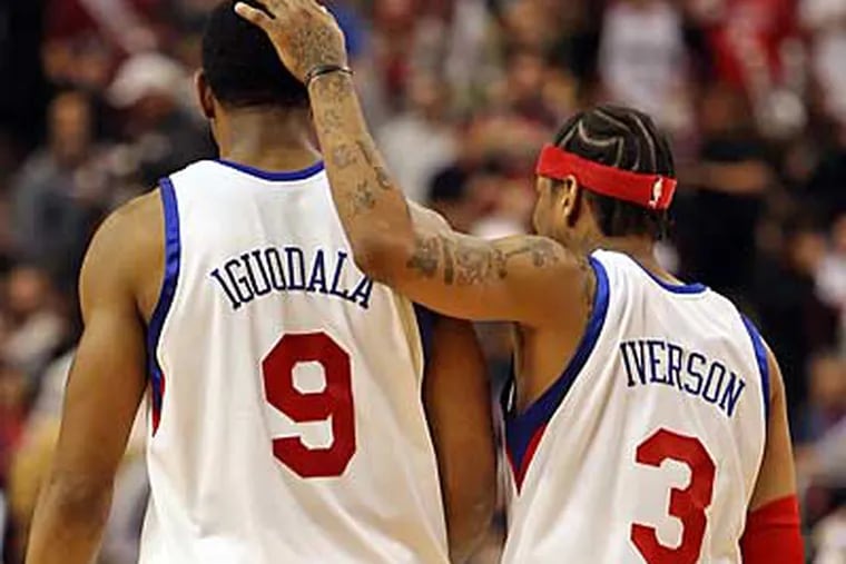 The Sixers' Allen Iverson consoles teammate Andre Iguodala after missing a 3 point shot that could have won the game with seconds left against the Pistons. The Pistons won 90-86.  ( Steven M. Falk / Staff Photographer )