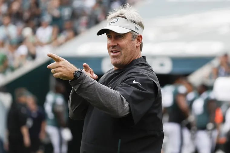 Eagles head coach Doug Pederson acknowledges fans before the start of open practice at Lincoln Financial Field in South Philadelphia on Saturday, August 11, 2018. YONG KIM / Staff Photographer