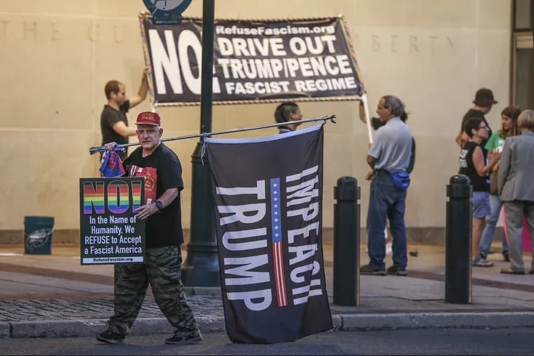 Anthoney Novotny 57, from Havertown marches with Refuse Fascism has they protest Trumps' nomination for the Supreme Court in front of the Philadelphia Federal Courthouse , Monday, July 9, 2018.