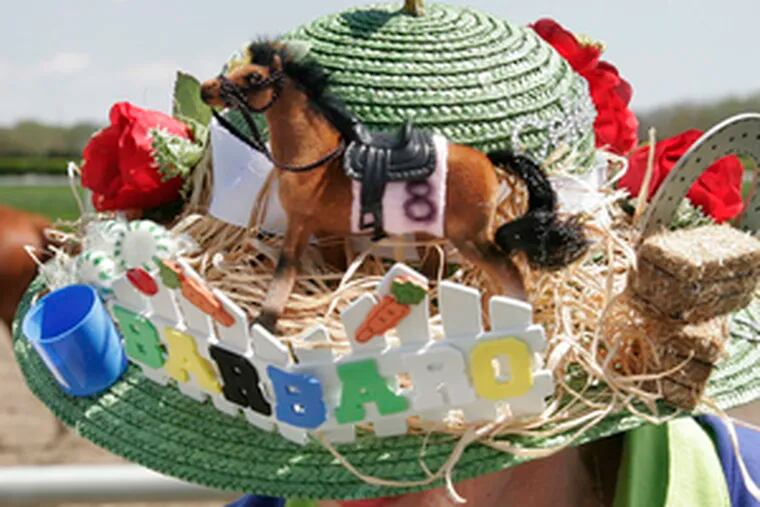 A custom-made hat is worn by Mary Ann Savage of Ellicott City, Md., at Barbaro&#0039;s Delaware Park party.