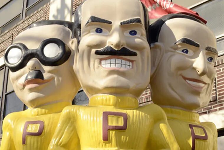 Statue of Manny, Moe & Jack outside Pep Boys' Philadelphia headquarters, above, and a nearby store, below, both on Allegheny Avenue. (Tom Gralish / Staff Photographer)