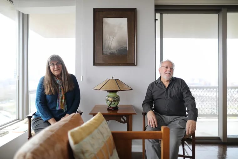 Kathy Cater and Geoffrey Agrons live on the 18th floor with a view of Philadelphia's Art Museum. Inside the apartment they house their own collection of arts and crafts furnishings and photography, including a prized photo of a California eucalyptus grove shrouded in fog.