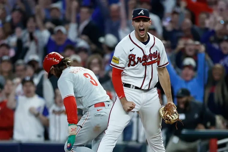 Braves first baseman Matt Olson celebrates after Bryce Harper was doubled up at first base to end Game 2.