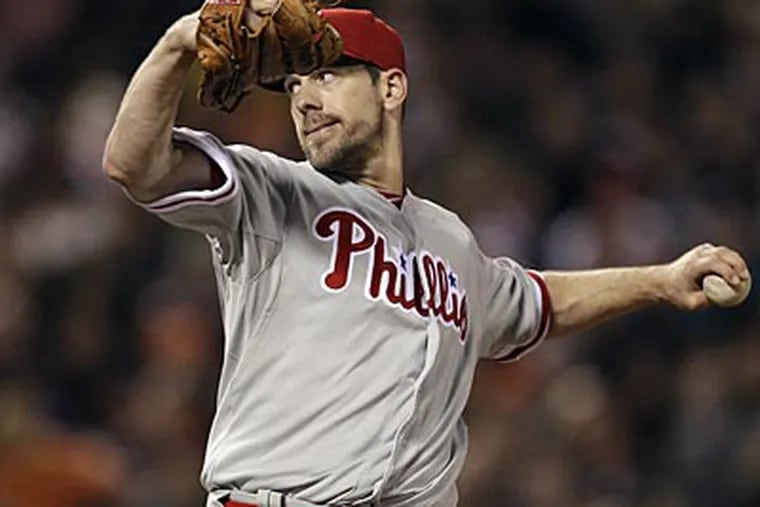 Phillies starter Cliff Lee injured himself on a pitch in the 10th inning on Wednesday. (Marcio Jose Sanchez/AP)