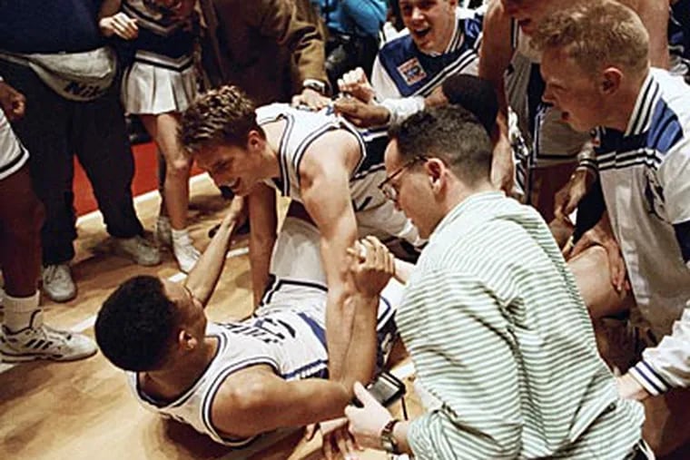 Christian Laettner celebrates with Grant Hill after Duke defeated Kentucky, 104-103, in 1992. (Amy Sancetta/AP file photo)