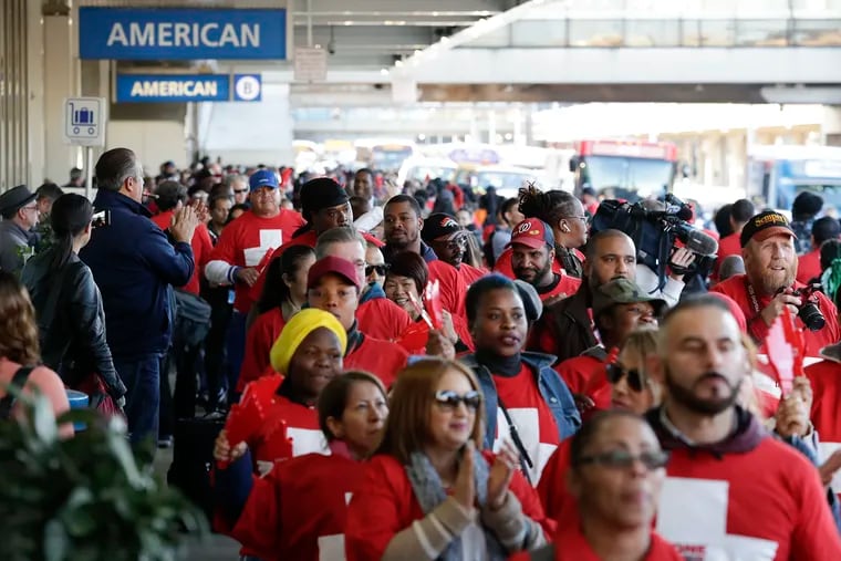 UNITE HERE demonstrators march in front of terminal B and C at the Philadelphia International Airport during a protest against high healthcare costs on Thursday, October 24, 2019. The airport's lease agreement with American Airlines and other airlines will be a major issue for unions UNITE HERE and 32BJ SEIU in 2020.