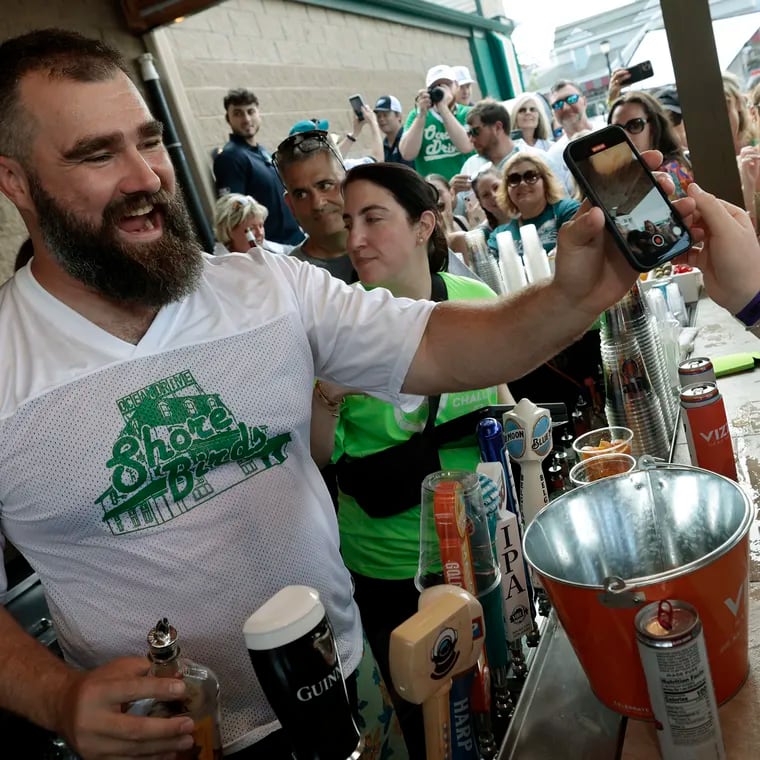 Jason Kelce takes selfies and pours fireballs while bartending at O'Donnell's Pour House last June in Sea Isle City, N.J.