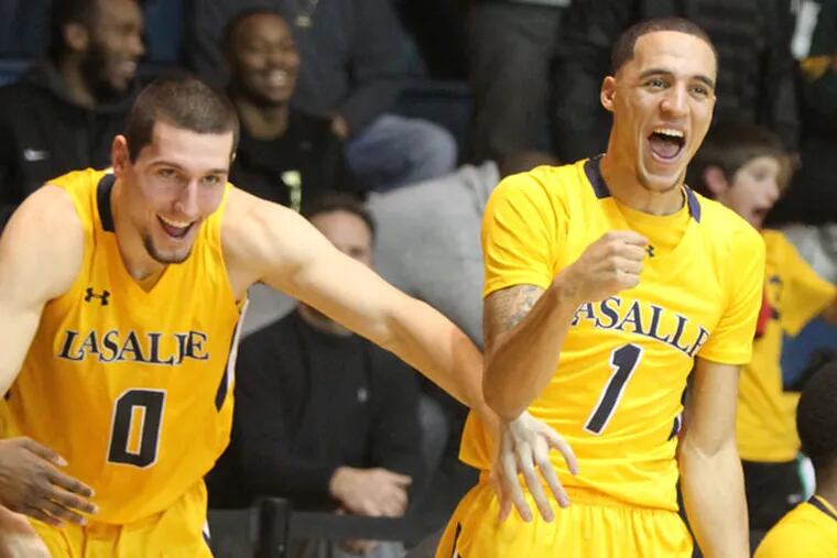 La Salle's Steve Zack (left) and D.J. Peterson celebrate as teammate
Hank Davis scores in the final seconds of the game. (Charles Fox/Staff Photographer)