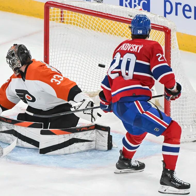 The Canadiens' Juraj Slafkovsky scores his third goal against Flyers goaltender Samuel Ersson.