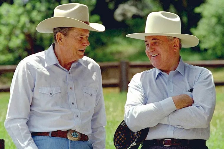Former President Ronald Reagan, left, and former Soviet President Mikhail Gorbachev don cowboy hats while enjoying a moment at Reagan's Rancho del Cielo north of Santa Barbara, Calif., in May 1992.