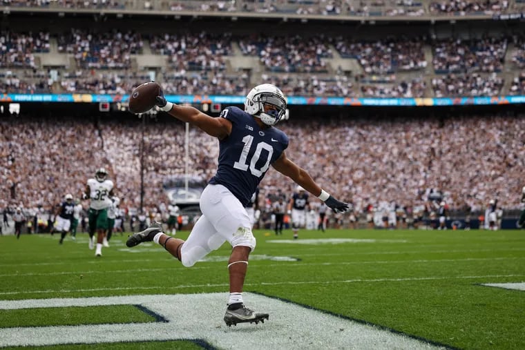 STATE COLLEGE, PA - SEPTEMBER 10: Nicholas Singleton #10 of the Penn State Nittany Lions celebrates after scoring a touchdown against the Ohio Bobcats during the first half at Beaver Stadium on September 10, 2022 in State College, Pennsylvania. (Photo by Scott Taetsch/Getty Images)